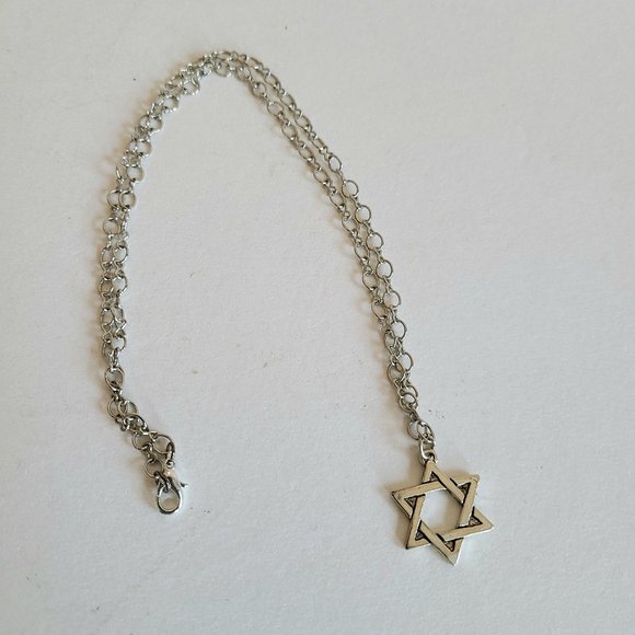 Jewelry - Silver color metal Star of David pendant.
